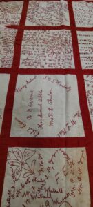 Handstitched quilt with peoples names