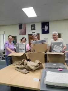 The Volunteers at Orangeburg County Historical Society Laura Hatt, Beth Guess, Anne Bettis, and Margaret Waters opening the donated boxes for our family surname files